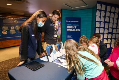 young aquarium visitors at information table