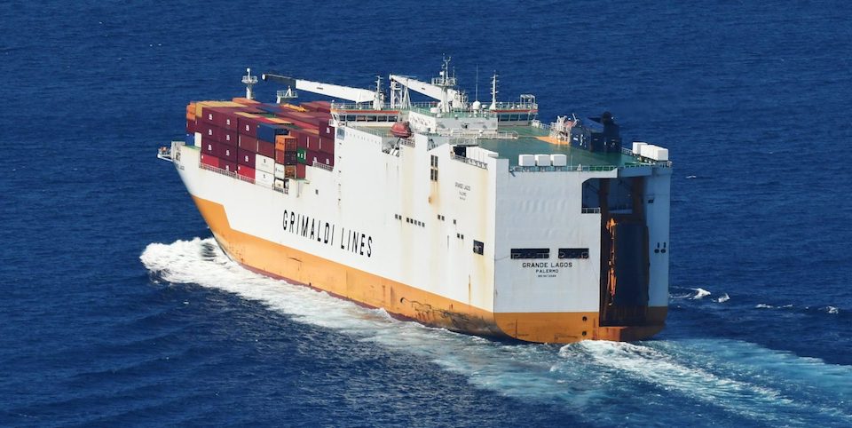 White and yellow cargo vessel