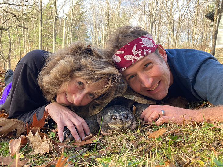 Sy Montgomery and Matt Patterson with a snapping turtle.