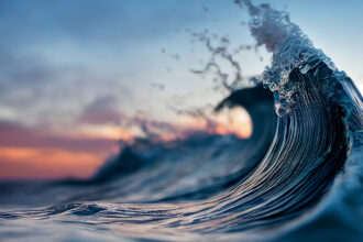 foamy waves rolling up in ocean