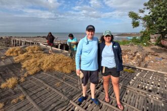 Matt and Lena on a seaweed drying rack